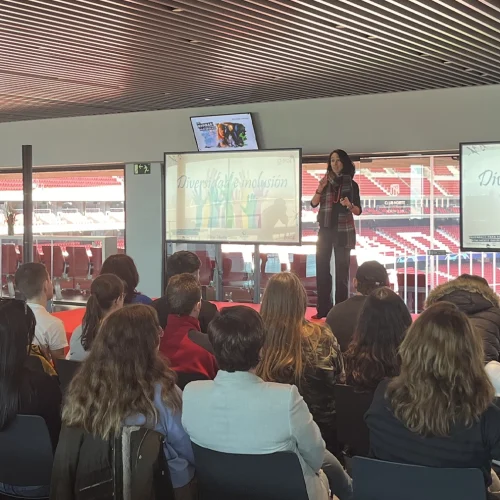 Elena Martín, Director of Sustainability, speaks about the importance of diversity and inclusion at the Cívitas Metropolitano on a sunny day, with the stadium in the background.