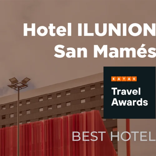 Kayak Travel Awards. Tall, modern building with a red and black façade, featuring the name 