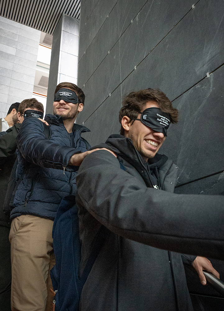 Young people with arms around each other visiting ILUNION Atrium