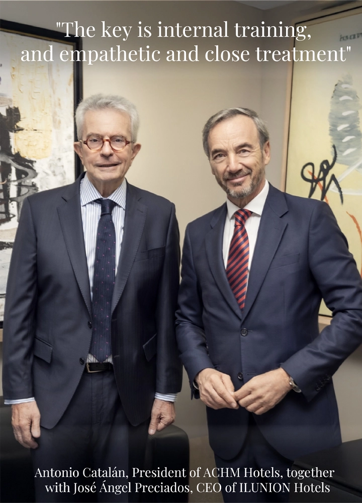 Antonio Catalán and José Ángel Preciados in suits, standing in front of abstract artwork. Quote reads: 'The key is internal training and empathetic treatment'.