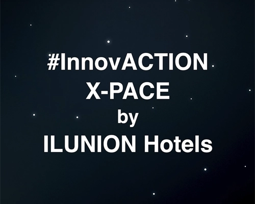 Texto en letras blancas sobre un fondo oscuro que simula un cielo estrellado o el espacio. El mensaje dice: '#InnovACTION X-PACE by ILUNION Hotels'